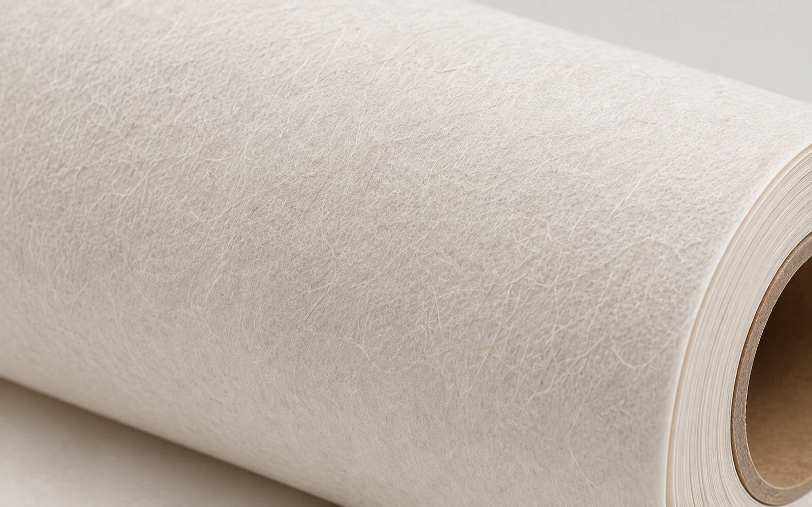 Close-up of the uncoated fibre texture of a rolled paper map