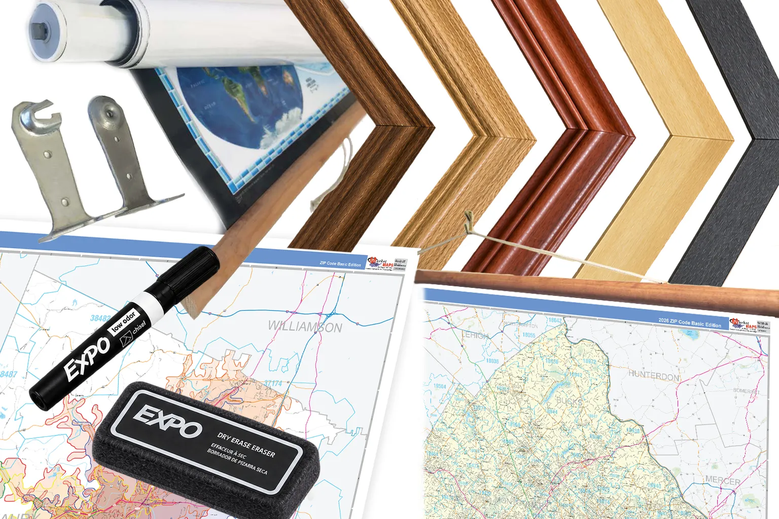 Finishing samples: a spring roller with its brackets, wood and black frame corners, a map on wooden rails, and a laminated map with a dry-erase marker and eraser