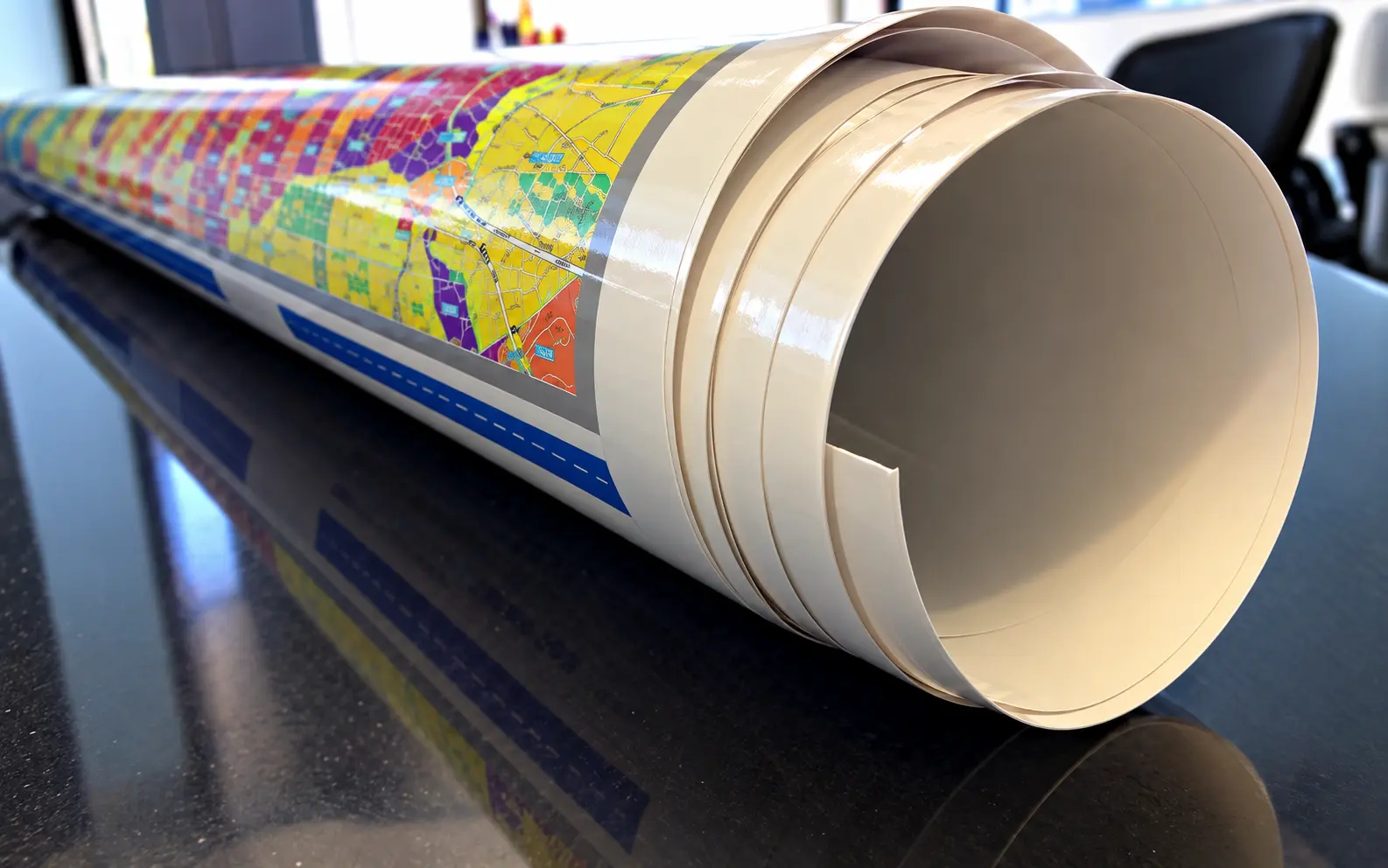 Laminated map rolled up for storage