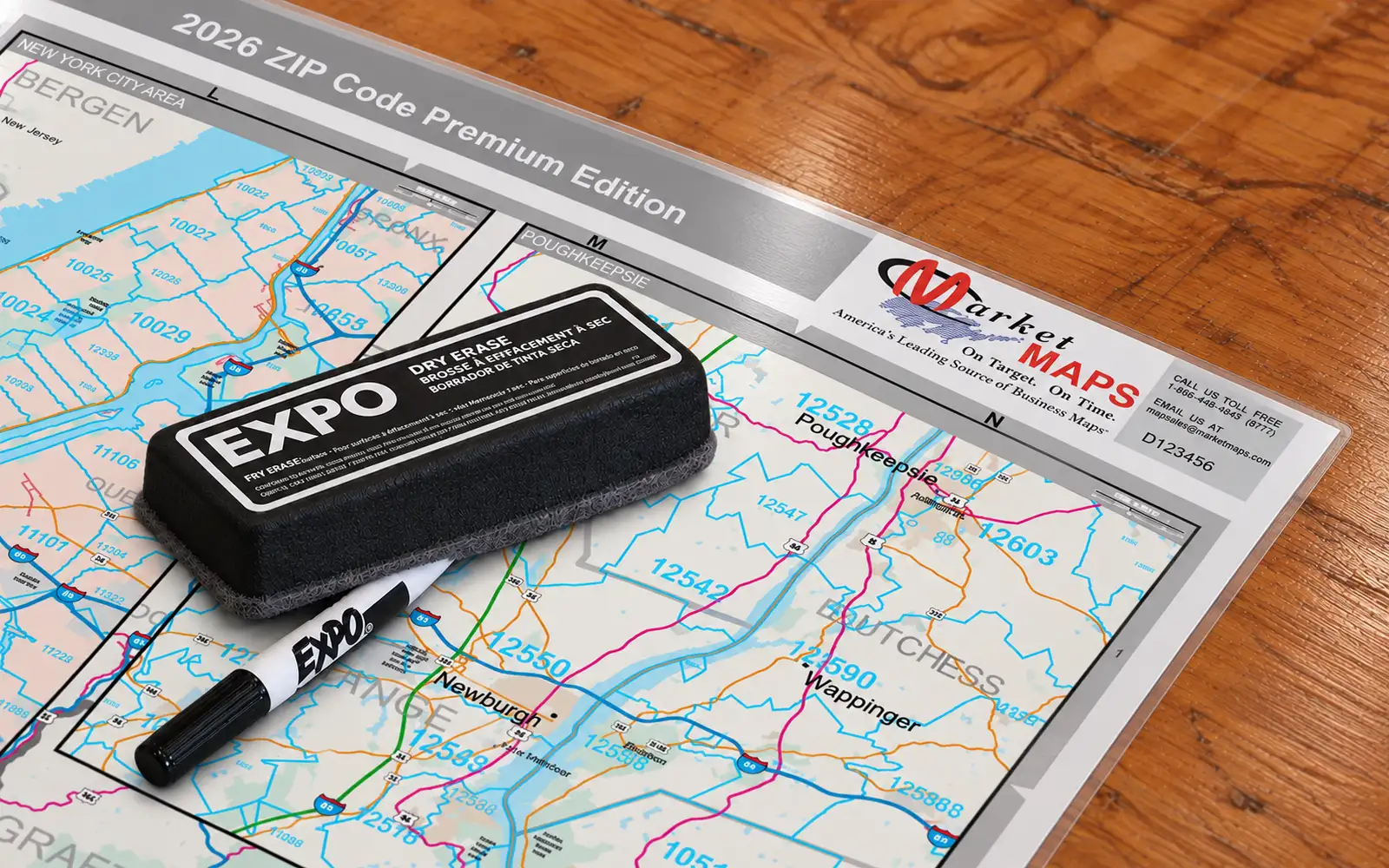 Dry-erase marker drawn across a laminated map, with markers resting on it