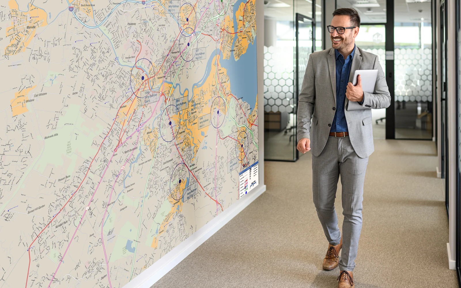 A corridor with a regional map mural running the length of the wall