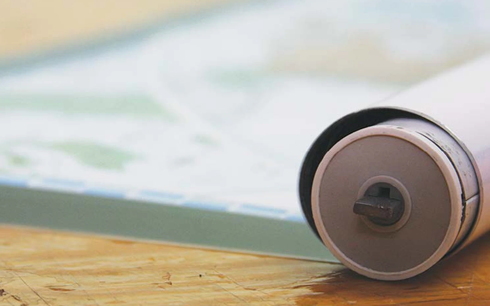 Close-up of the spring mechanism in the end of a roller tube