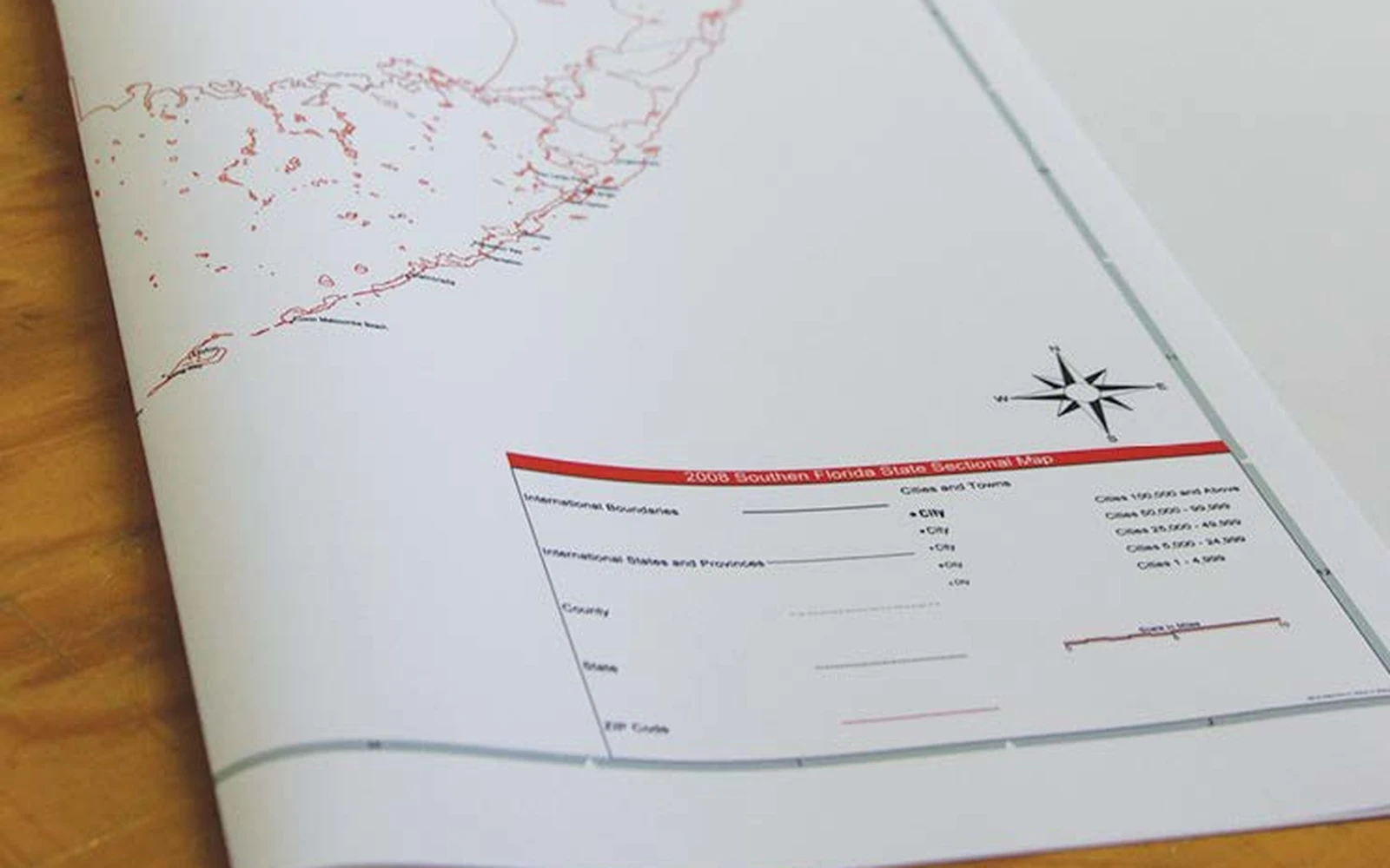 A synthetic paper map folded back on itself without creasing the print